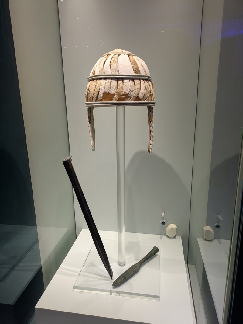Mycenaean boar-tusk helmet on display in a museum